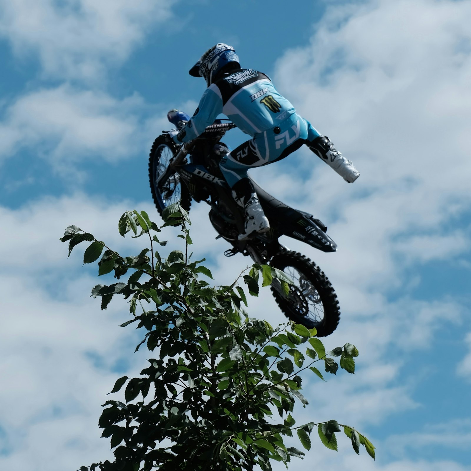 Motorcycle rider performing aerial stunt