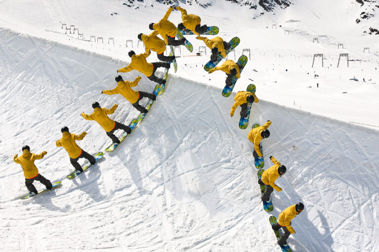 Snowboarder alley-oop halfpipe trick
