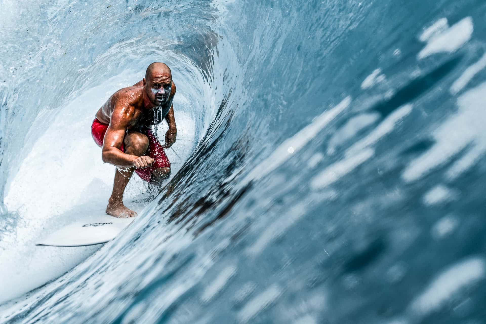 Big wave surfer deep in a barrel